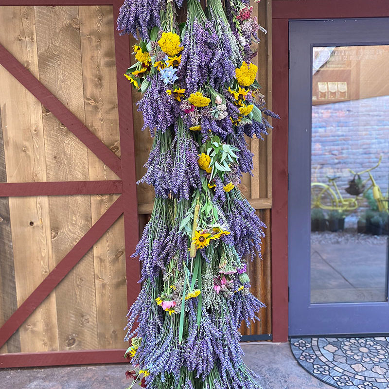hanging vertical lavender and sunflower floral arrangement